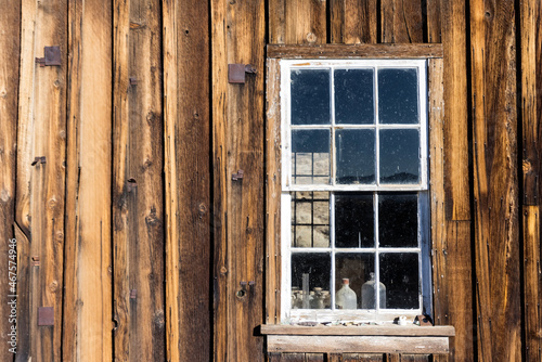 Window frame in a wood building weathered by time landscape