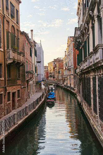 Venice, Italy - 10.12.2021: Traditional canal street with gondolas and boats in Venice, Italy. © Dima Anikin