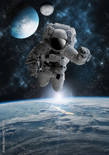 Fototapeta Naklejka Na Ścianę i Meble -  Astronaut in outer open space over the planet Earth.Stars provide the background.erforming a space above planet Earth.Sunrise,sunset.Our home. ISS.Elements of this Image Furnished by NASA.