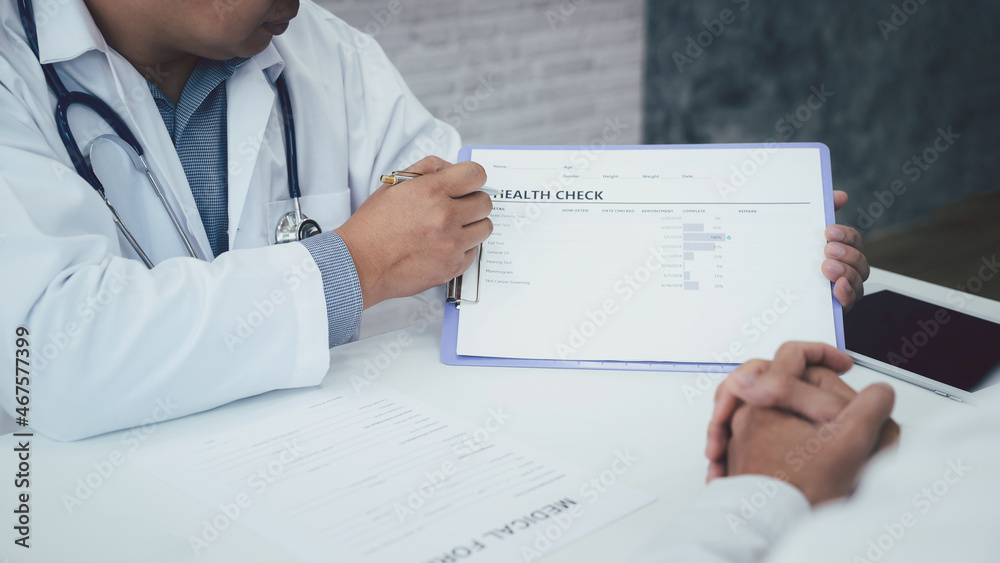 A doctor consulting and explain patient health check in office. Medicine and health care concept.