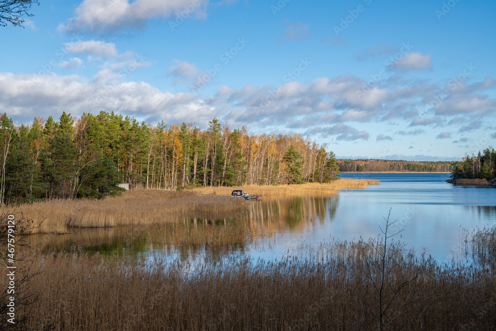 Fototapeta premium Coastal view and Gulf of Finland, trees, grass and sea, Kopparnas-Klobbacka recreation area, Finland