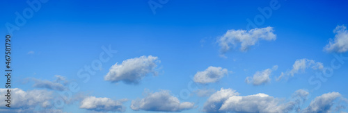 Blue sky background with tiny clouds. Panorama