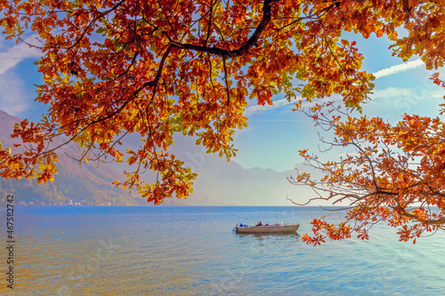 Bright autumn landscape, golden foliage over the lake