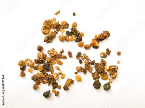 Myrrh is a natural gum or resin extracted from a number of small, thorny tree species of the genus Commiphora Isolated on white