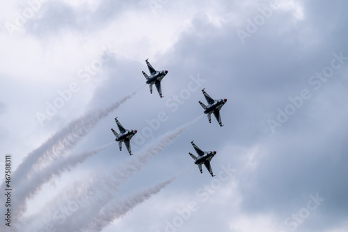 Group of flying aircraft against a cloudy sky during the National Air Show in Cleveland, USA
