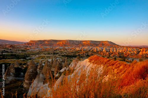 Cappadocia view at sunset from Asiklar Tepesi in Goreme. Cappadocia background photo. Beautiful sunset point in Goreme. Natural beauties of Turkey.