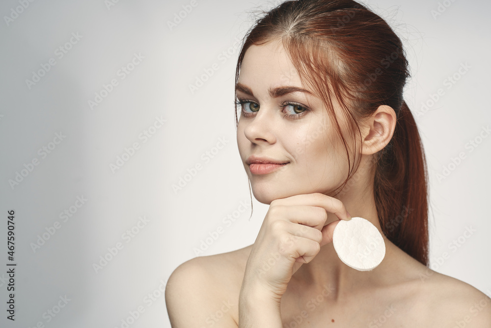 woman with bare shoulders cotton pad clean skin light background woman with bare shoulders cotton pad clean skin light background