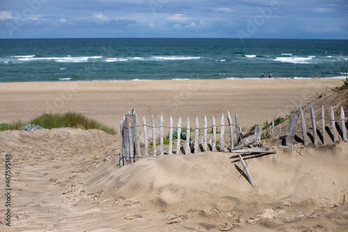 Landscape shot of the beautiful beach at Soulac-Sur-Mer, France, Médoc with marine detail in the foreground photo