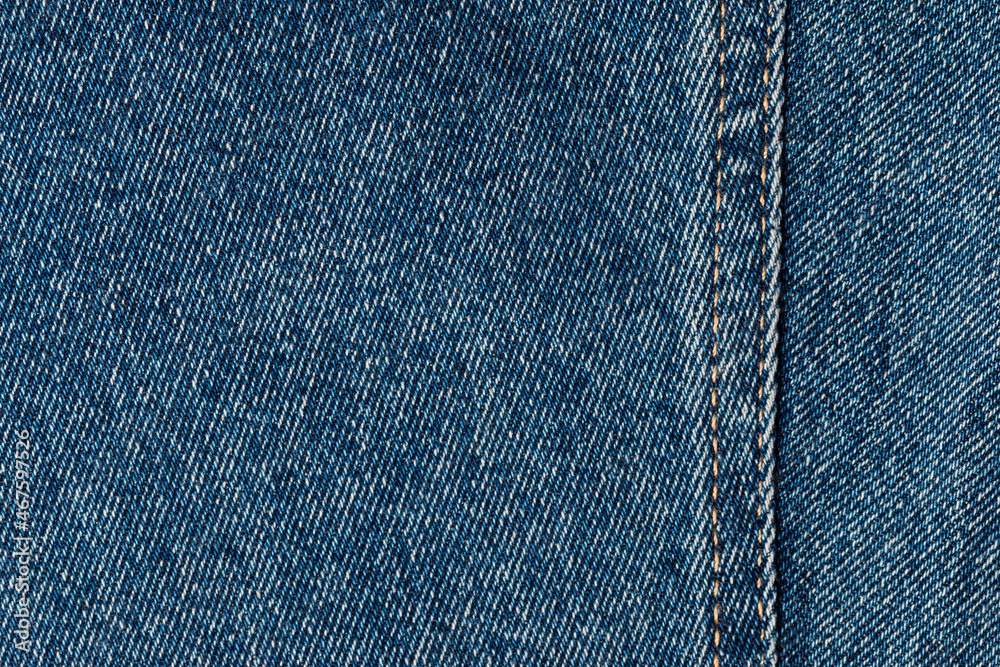 blue denim texture with side double seam. thread stitches on the background of denim textiles. a place to copy. Abstract background and texture for design. blue denim texture with side double seam. thread stitches on the background of denim textiles. a place to copy. Abstract background and texture for design.