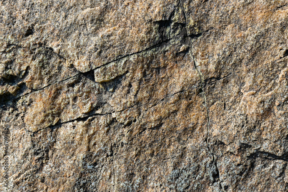 Texture of granite rock. Cracked stone surface from weathering. Close up of granite surface. Earth color concept Texture of granite rock. Cracked stone surface from weathering. Close up of granite surface. Earth color concept