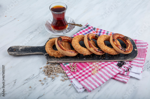 Turkish Bagel Kandil simiti with tea (stack of pastry). A savory, ring-shaped biscuits kandil simidi usually eaten on holy nights. photo
