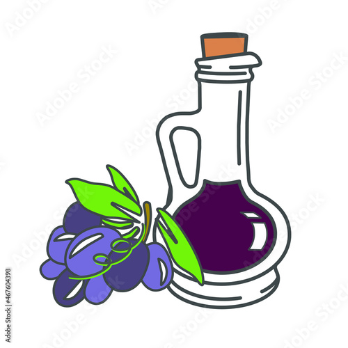 Glass with grape vinegar and bunch of blue ripe grape with leaves, isolated