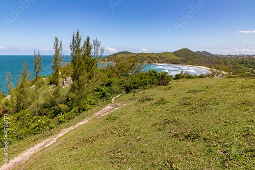 Trail over the cliffs with beach in background photo