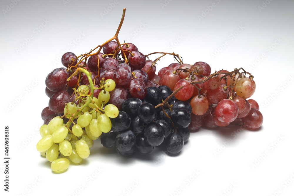 Bunch of Black and Red Grape with Green Seedless Grape isolated on white backgrounds.