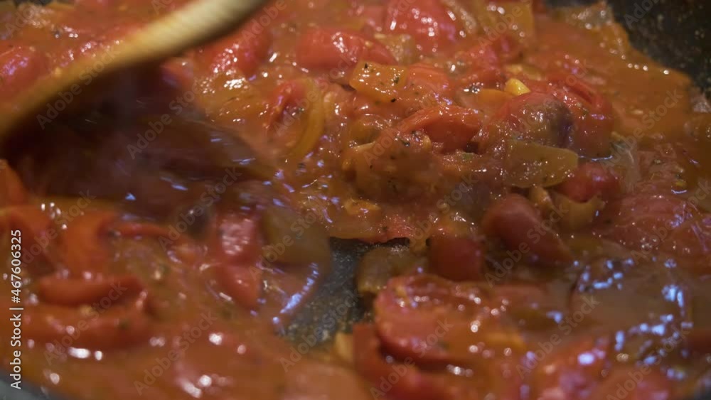 homemade tomato sauce simmering in the pan homemade tomato sauce simmering in the pan