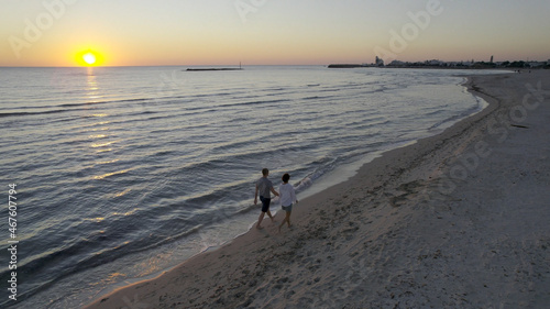 A Couple Walking on the Beach at Sunset, Aerial