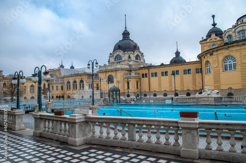 Old yellow thermal bath Széchenyi with hot steaming water in the middle of the city center of Budapest (Hungary)