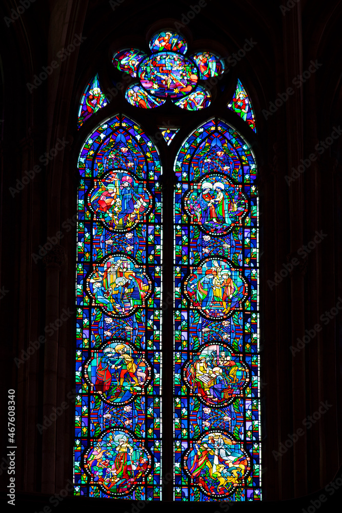Religious stained glass window inside the cathedral of Verdun in France

