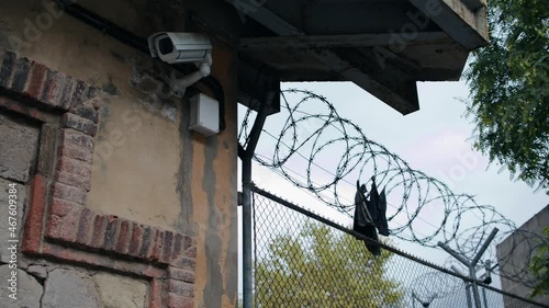 Scraps of prisoner clothing on the barbed wire of the prison.  The outdoor surveillance camera didn't detect the jailbreak.