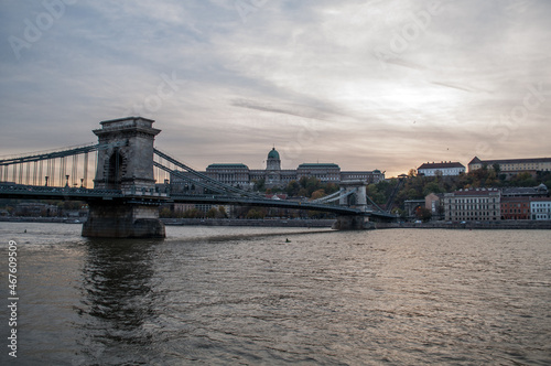 The Chain Bridge in Budapest  Hungary  over the Danube River with the setting evening sun in the background