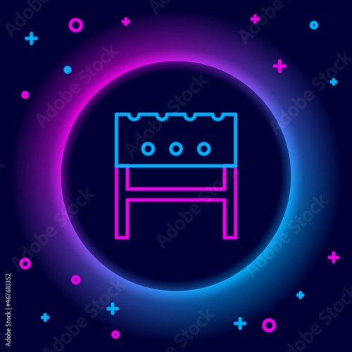 Glowing neon line BBQ brazier icon isolated on black background. Colorful outline concept. Vector