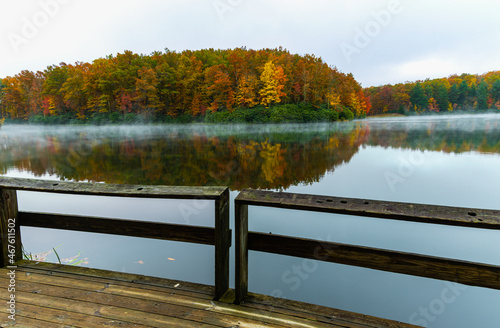 Fall Color and Fishing Pier Reflectiong on Boley Lake, Babcock State Park, West Virginia, USA photo