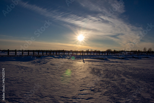 Sunset Over Frozen Lake