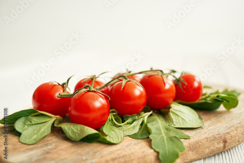 cherry tomatoes lettuce leaves wooden board fresh food