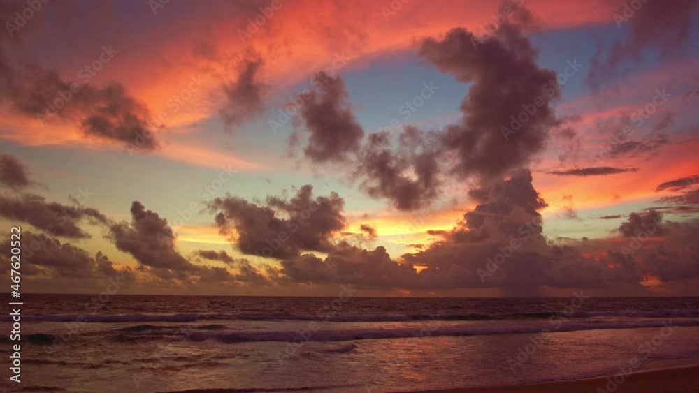 Scene of Colorful romantic red sky sunset with Changing the color of the sky background. 
beautiful large red cloud at sunset above Phuket city.
beautiful red sky at sunset nature and travel concept