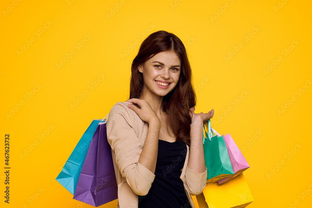 pretty woman shopping entertainment lifestyle yellow background pretty woman shopping entertainment lifestyle yellow background