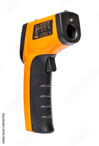 Yellow Infrared thermometer gun used to measure temperature on white background