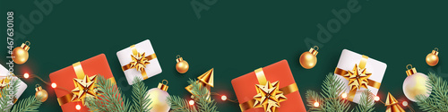 Christmas horizontal border made of realistic 3d fir branches, gift boxes, golden conical Christmas trees, balls and lights isolated on deep green background. Xmas banner, poster, card, website header