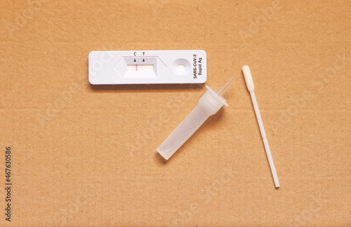 Rapid Covid-19 coronavirus strip test cassette for antibody disease epidemic on brownpaper background. photo