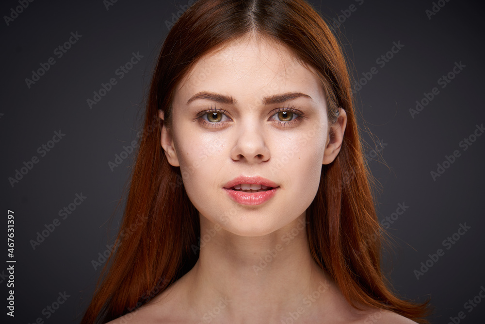 woman with bare shoulders and beautiful hairstyle close-up attractive look