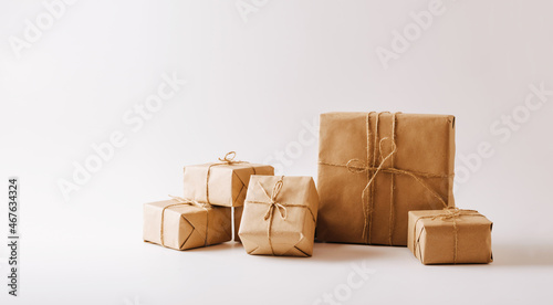 Gifts in eco-friendly paper packaging on a white background. Copy space concept minimalism