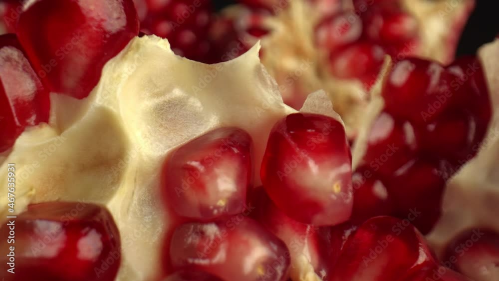 Red translucent grains of pomegranate tree, soft film partition of fruit. The fruit has an antibacterial and anti-inflammatory effect. High quality. 4k footage. Red translucent grains of pomegranate tree, soft film partition of fruit. The fruit has an antibacterial and anti-inflammatory effect. High quality. 4k footage.