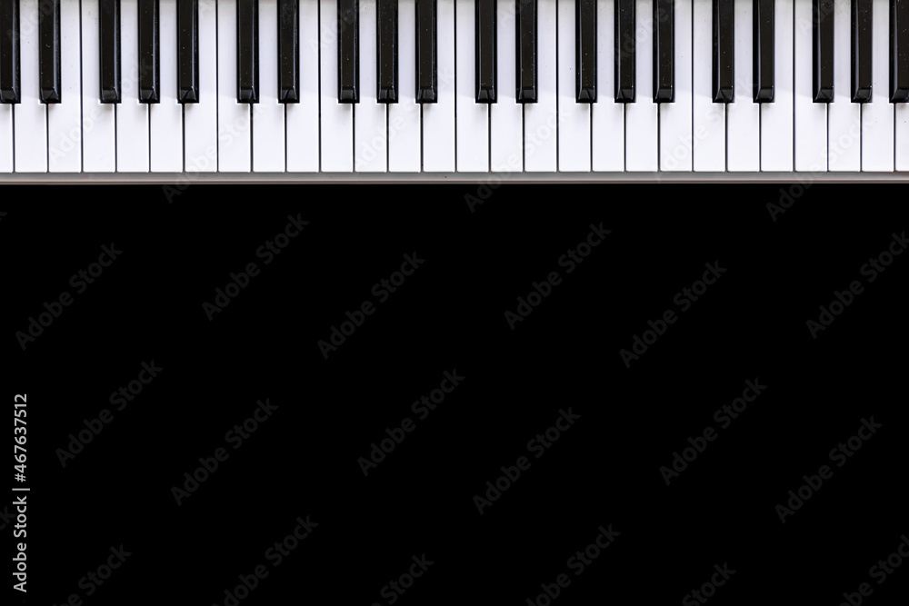 Musical background with musical keys on black, flat lay, copy space. Musical background with musical keys on black, flat lay, copy space.