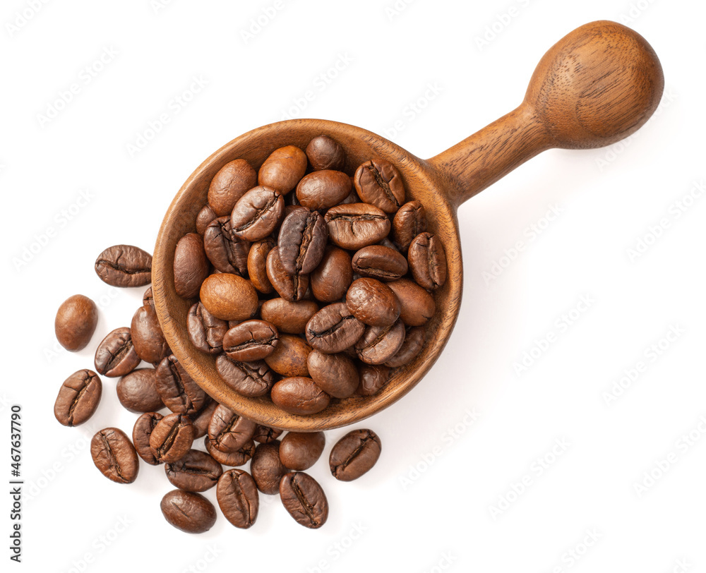 Fototapeta premium Coffee beans in the wooden spoon, isolated on white background, top view