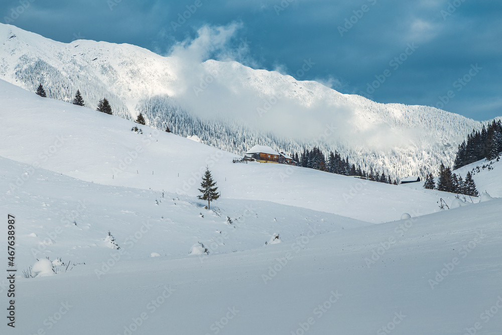 Winter landscape with high snowy mountain ridge, Carpathians, Romania