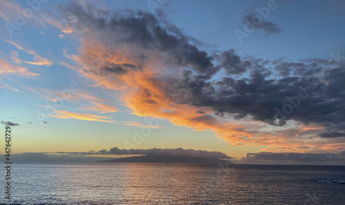 Beautiful sunset over the ocean with dramatic clouds and sky