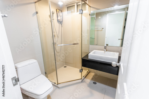 Clean and white bathroom with amenities.