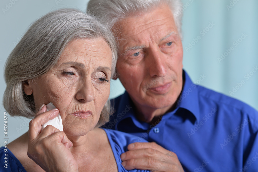 Portrait of sad senior couple posing at home Portrait of sad senior couple posing at home
