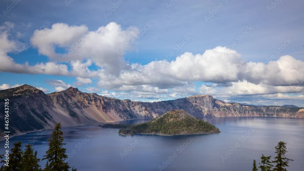 Time lapse of puffy clouds moving across the sky above Crater Lake in Oregon