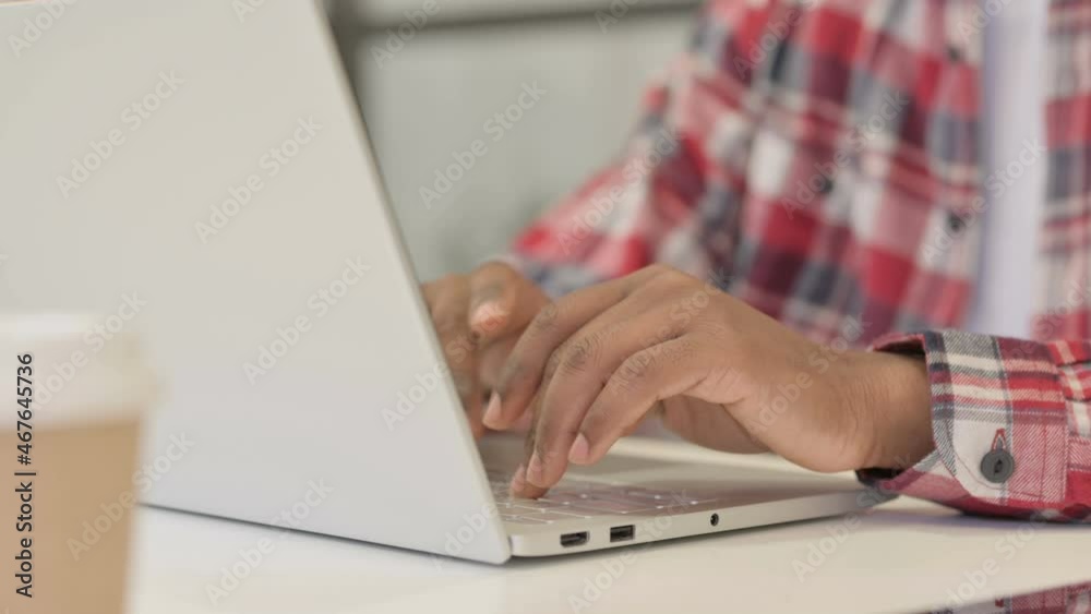 Close up of African Man Typing on Laptop Close up of African Man Typing on Laptop