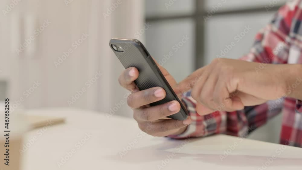 Close up of African Man using Smartphone Close up of African Man using Smartphone