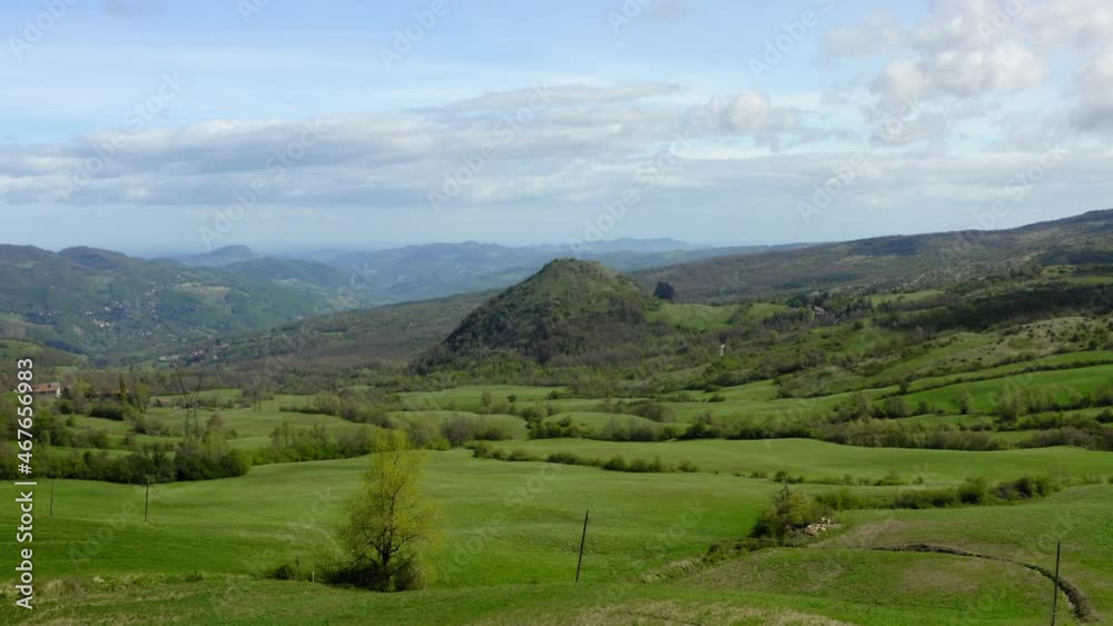 Aerial: Beautiful Shot Of Green Hills Against Cloudy Sky, Drone Flying Forward Over Landscape - Apennine Mountains, Italy Aerial: Beautiful Shot Of Green Hills Against Cloudy Sky, Drone Flying Forward Over Landscape - Apennine Mountains, Italy