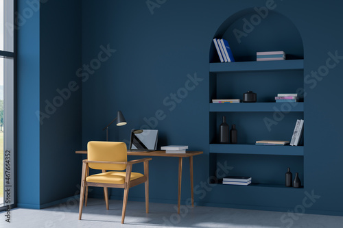 Workplace interior with table and laptop on concrete floor. Mockup