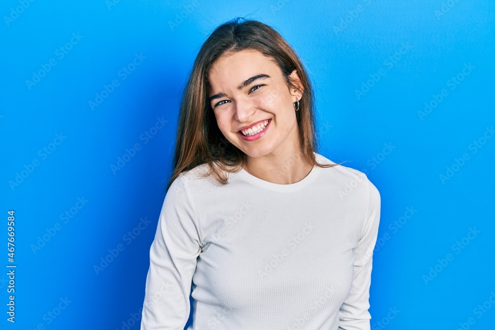 Young caucasian girl wearing casual clothes with a happy and cool smile on face. lucky person. Young caucasian girl wearing casual clothes with a happy and cool smile on face. lucky person.