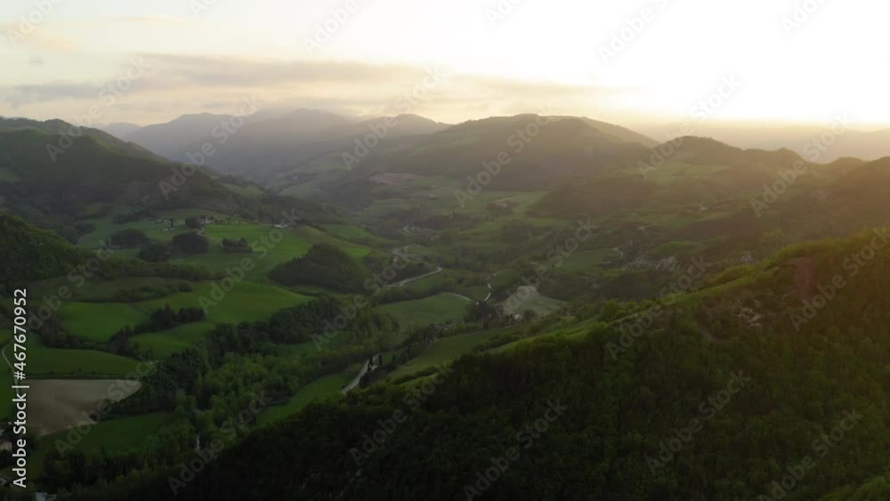 Aerial Scenic View Of Natural Hills During Sunset, Drone Flying Over Green Trees On Landscape - Apennine Mountains, Italy Aerial Scenic View Of Natural Hills During Sunset, Drone Flying Over Green Trees On Landscape - Apennine Mountains, Italy