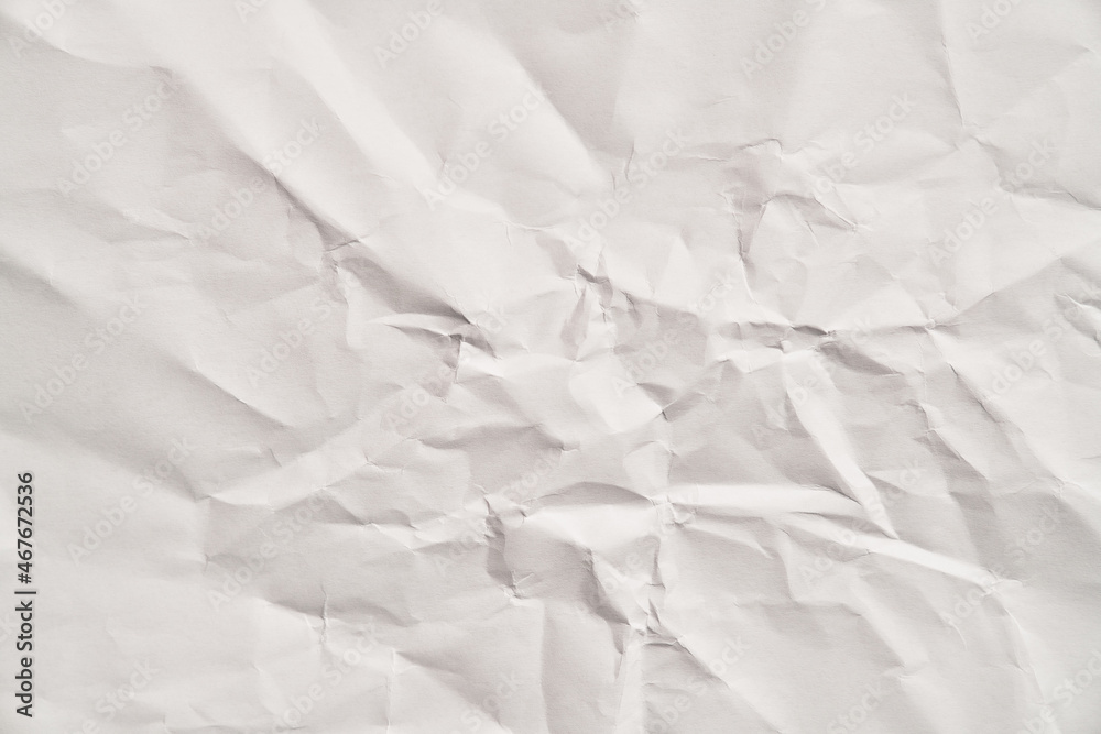 White crumpled paper texture with wrinkles. Damaged and torn sheet White crumpled paper texture with wrinkles. Damaged and torn sheet